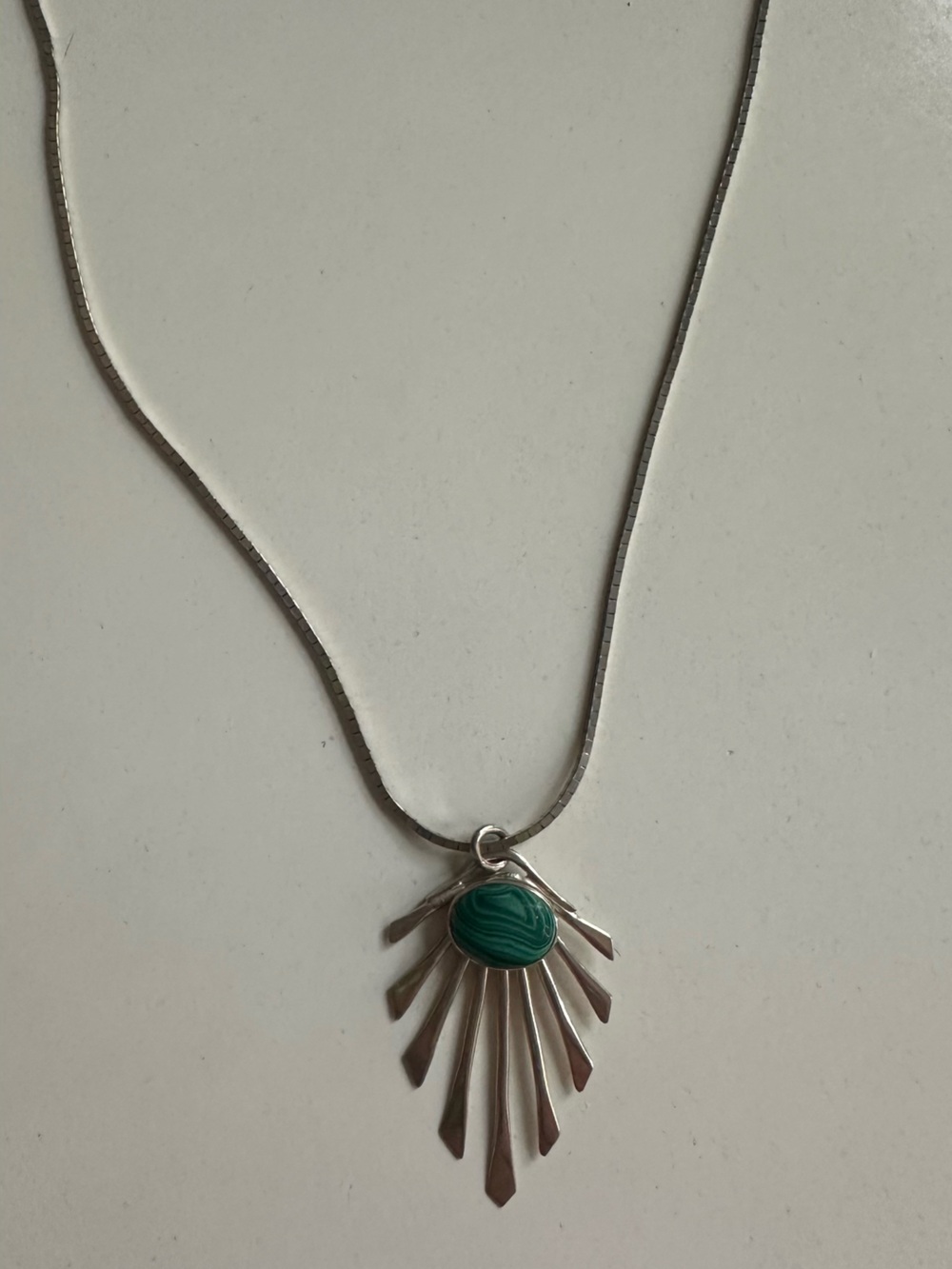 Silver Sunburst Pendant Necklace with Green Stone